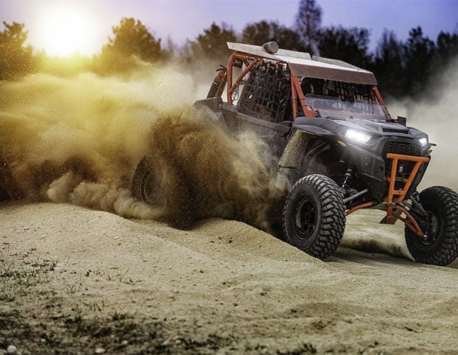 UTV driving off road in the sand